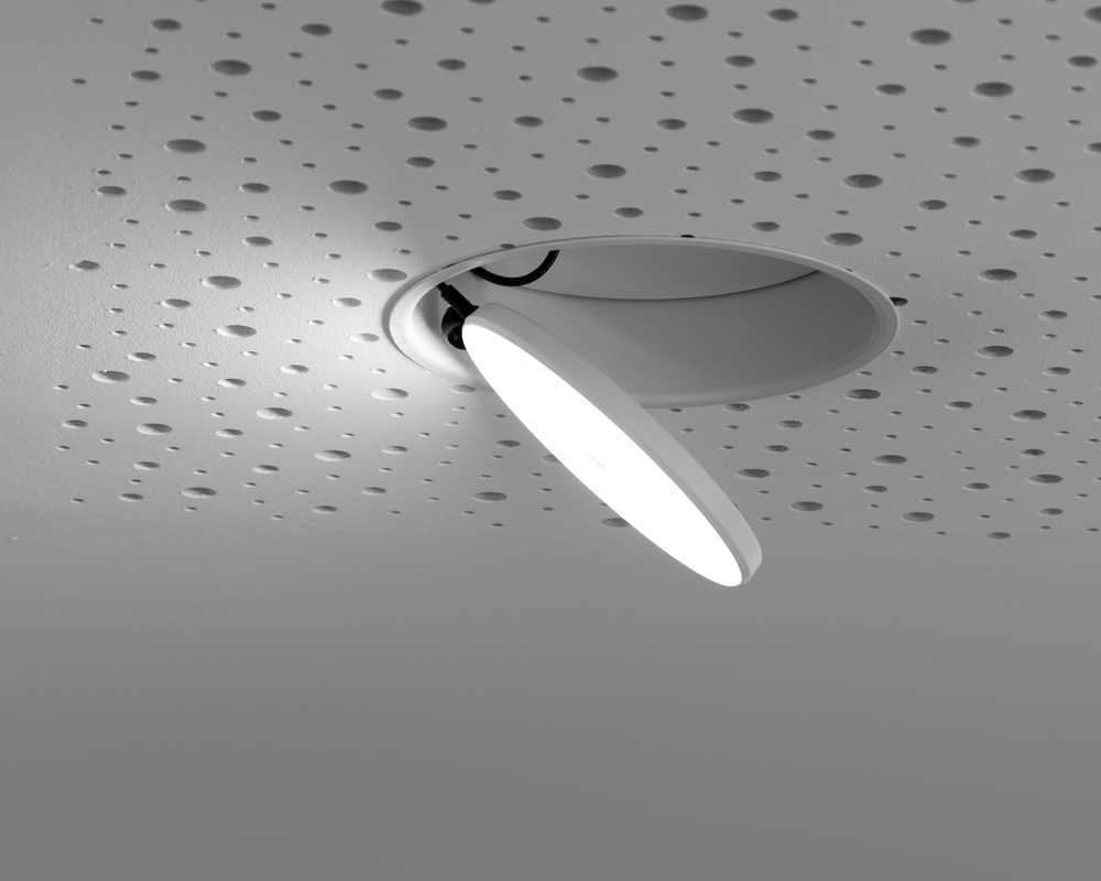 White round, flat, fold-out and rotatable semi-recessed AVVENI downlight with frame in white perforated ceiling.