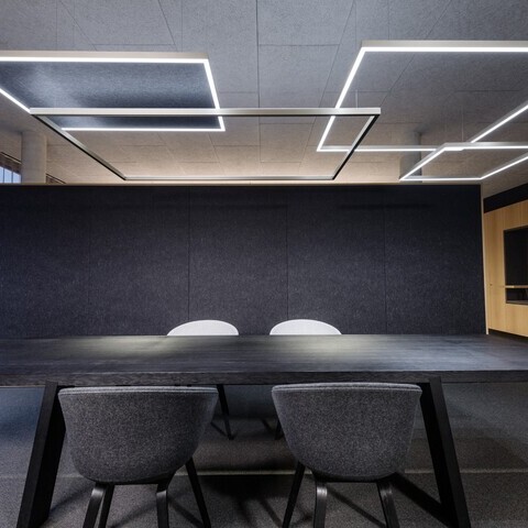 Slim LED pendant with acoustic panel – minimalist office aesthetics