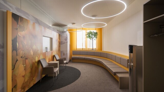Three filigree SLIM DIRECT LED ring lights by SATTLER in the waiting area of MVZ Bad Berka medical practice, providing direct and comfortable illumination.