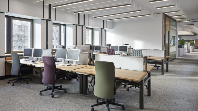 Linear SATTLER luminaires in a modern office workspace