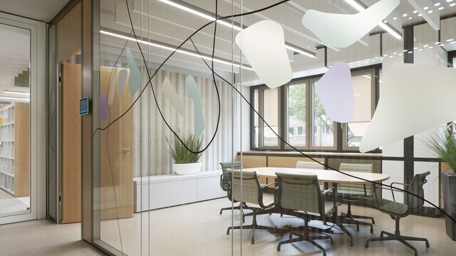 View through a graphically painted floor-to-ceiling glass pane into a meeting room. Above the table, room-wide white acoustic baffles and linear luminaires are arranged in rows one behind the other throughout the room.