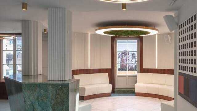 Reception area in the Postpalast, Budapest, with green marble and Sattler's Toccata 900 lighting fixtures with Luce Verde Anello. | ©  Tamás Bujnovszky