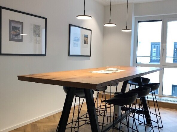 High table with pendant lights, modern lighting solution